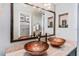 Bathroom with double sinks and large mirror at 657 Garland Cir, Indian Rocks Beach, FL 33785