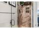 Shower with glass enclosure and pebble flooring at 657 Garland Cir, Indian Rocks Beach, FL 33785