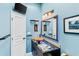 Bathroom with modern vanity, vessel sink, and decorative mirror at 657 Garland Cir, Indian Rocks Beach, FL 33785