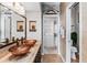 Bathroom with double sinks, walk-in shower, and large mirror at 657 Garland Cir, Indian Rocks Beach, FL 33785