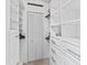 Spacious walk-in closet with built-in shelving and drawers at 657 Garland Cir, Indian Rocks Beach, FL 33785