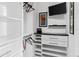 Large closet with shelves, drawers, and hanging space at 657 Garland Cir, Indian Rocks Beach, FL 33785