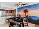 Modern kitchen with stainless steel appliances and breakfast bar at 657 Garland Cir, Indian Rocks Beach, FL 33785