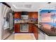 Modern kitchen with stainless steel appliances and granite countertops at 657 Garland Cir, Indian Rocks Beach, FL 33785