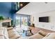 Spacious living room with water views and a large TV at 657 Garland Cir, Indian Rocks Beach, FL 33785