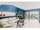 Relaxing living room with water views, fireplace, and comfortable seating at 657 Garland Cir, Indian Rocks Beach, FL 33785