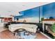 Open living space with a large sectional sofa and a view of the kitchen at 657 Garland Cir, Indian Rocks Beach, FL 33785