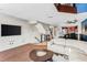 Open concept living area with kitchen and staircase views at 657 Garland Cir, Indian Rocks Beach, FL 33785