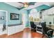 Spacious office with built-in desk, hardwood floors, and ceiling fan at 657 Garland Cir, Indian Rocks Beach, FL 33785