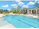 Resort-style pool with lounge chairs and a pergola at 695 Allora Ave, Nokomis, FL 34275