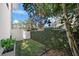 Landscaped backyard with lush greenery and a wall at 720 16Th Ne Ave, St Petersburg, FL 33704