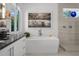 Elegant bathroom with a modern freestanding tub and walk-in shower at 720 16Th Ne Ave, St Petersburg, FL 33704