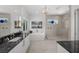 Spa-like bathroom with soaking tub, walk-in shower, and double vanity at 720 16Th Ne Ave, St Petersburg, FL 33704