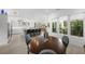 Modern dining area with a wooden table and blue chairs near the kitchen at 720 16Th Ne Ave, St Petersburg, FL 33704