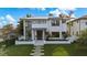 Modern two-story home with a sleek design and lawn at 720 16Th Ne Ave, St Petersburg, FL 33704