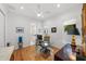 Bright home office features a glass desk, hardwood floors, and built-in shelving at 720 16Th Ne Ave, St Petersburg, FL 33704
