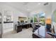 Bright home office features a large desk and window views at 720 16Th Ne Ave, St Petersburg, FL 33704