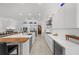 Modern kitchen features a large island, stainless steel appliances, and white cabinets at 720 16Th Ne Ave, St Petersburg, FL 33704