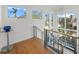 Stylish staircase with wood flooring and cable railing at 720 16Th Ne Ave, St Petersburg, FL 33704