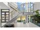 Modern staircase with glass and metal railing, and built in fish tank at 720 16Th Ne Ave, St Petersburg, FL 33704