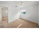 Bedroom with carpeting, window, and built-in closet at 8002 Sane Pl, Tampa, FL 33610