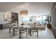 Elegant dining room with glass table, modern chairs, and ocean views at 805 S Gulfview Blvd # 607A, Clearwater, FL 33767
