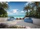 Tranquil patio with water features, lounge chairs, and ocean views at 805 S Gulfview Blvd # 607A, Clearwater, FL 33767