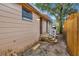 Side exterior featuring a back entrance, showcasing the home's practical design and access at 8204 N 13Th St, Tampa, FL 33604