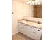 Double vanity bathroom with granite countertop and white cabinets at 946 Virginia St # 102, Dunedin, FL 34698