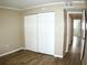 Spacious bedroom with large closet and wood-look tile floor at 946 Virginia St # 102, Dunedin, FL 34698