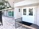 Community building exterior with double doors and sliding glass doors at 946 Virginia St # 102, Dunedin, FL 34698