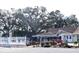 Community clubhouse nestled amongst mature trees at 946 Virginia St # 102, Dunedin, FL 34698