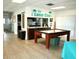 Community room with kitchenette and air hockey table at 946 Virginia St # 102, Dunedin, FL 34698