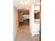 Bright entryway with tile flooring and view into living area and kitchen at 946 Virginia St # 102, Dunedin, FL 34698