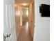 Clean hallway with tile floors and doors leading to other rooms at 946 Virginia St # 102, Dunedin, FL 34698