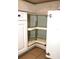 Corner cabinet with a pull-out shelving unit at 946 Virginia St # 102, Dunedin, FL 34698