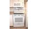 White electric range and microwave in the kitchen at 946 Virginia St # 102, Dunedin, FL 34698