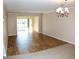 Living room with tile floors and view of patio and backyard at 946 Virginia St # 102, Dunedin, FL 34698