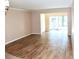 Spacious living room featuring tile flooring and access to a patio at 946 Virginia St # 102, Dunedin, FL 34698