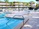 Inviting community pool area with ample seating at 946 Virginia St # 102, Dunedin, FL 34698