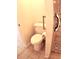 Bathroom with toilet and grab bar next to shower at 946 Virginia St # 102, Dunedin, FL 34698