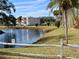 Peaceful canal-side view with a no fishing sign at 946 Virginia St # 102, Dunedin, FL 34698