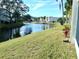 Scenic view of a canal with lush landscaping at 946 Virginia St # 102, Dunedin, FL 34698