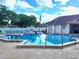 Inviting community pool with lounge chairs at 1040 Bowsprit Ln # 1306, Holiday, FL 34691