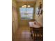 Small dining area with table and chairs near kitchen at 1040 Bowsprit Ln # 1306, Holiday, FL 34691