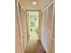 Hallway with built-in closets and bathroom access at 1040 Bowsprit Ln # 1306, Holiday, FL 34691