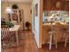 Kitchen with light wood cabinets and a breakfast bar at 1040 Bowsprit Ln # 1306, Holiday, FL 34691