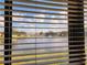 Scenic view of a lake from behind blinds at 1040 Bowsprit Ln # 1306, Holiday, FL 34691