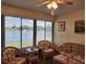 Sunroom with lake view and wicker furniture at 1040 Bowsprit Ln # 1306, Holiday, FL 34691