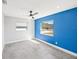 Bedroom with large window and blue accent wall at 1204 Dartmouth Dr, Bradenton, FL 34207